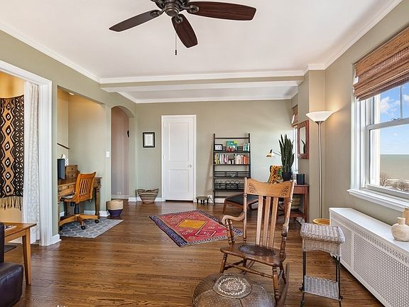 The living room also has a convenient nook for a desk or additional storage and a large closet