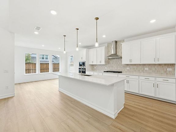 Spacious kitchen with open-concept design photos may depict options and features that aren t availa