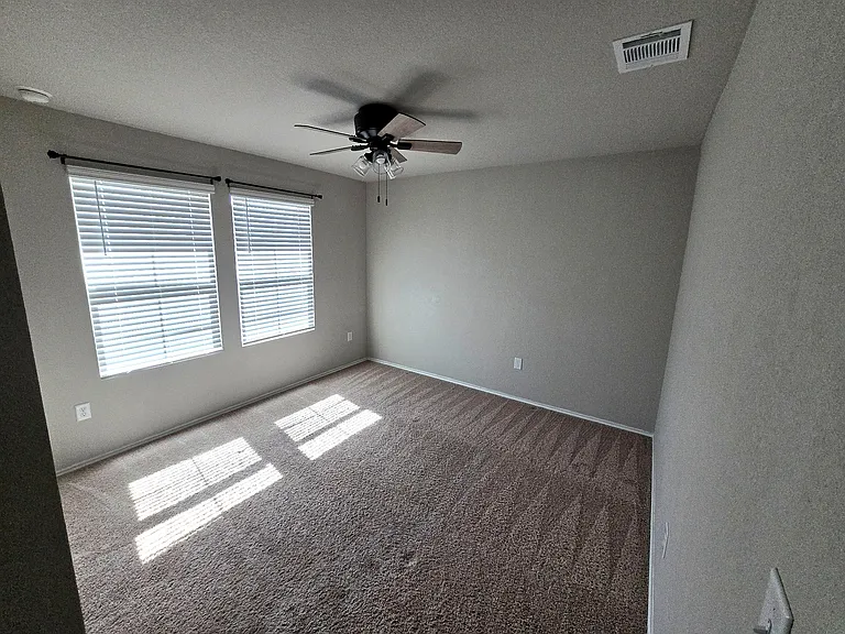 Bedroom 2: Well-sized bedroom ideal for guests, roommates, or office space.