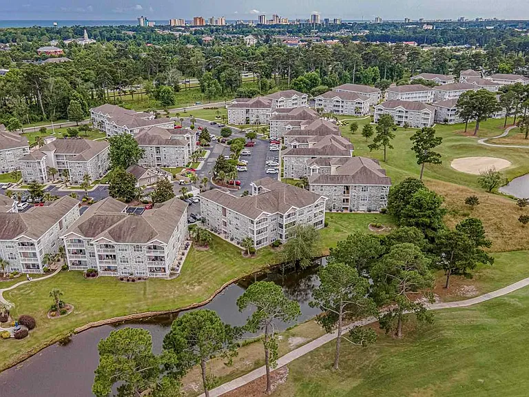 Serene pond and golf course view.