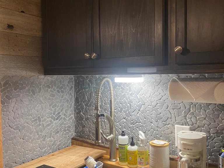 Kitchen with Keurig, pour-over cone, French press, water kettle, and drip coffee maker.