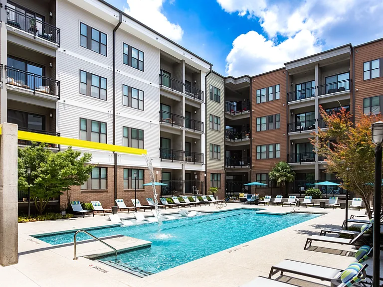 Resort-Style Pool with In-Pool Chaise Lounges and Fountain Features