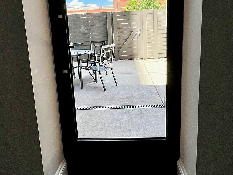 View onto the patio through the rear door. That brick building is the Richmond Convention Center; you're that close!