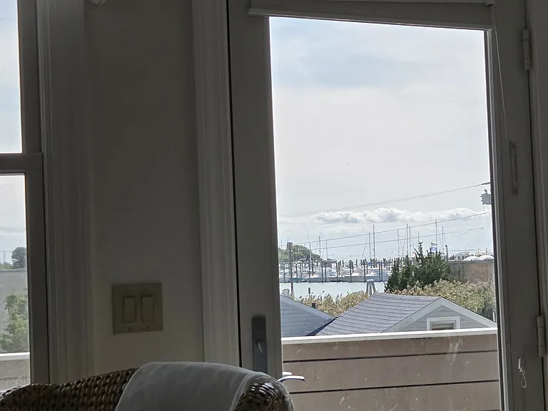 Door to large deck with water view... Sit and watch the ferries and boat traffic