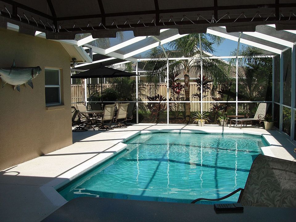 Extra large pool with birdcage screening.