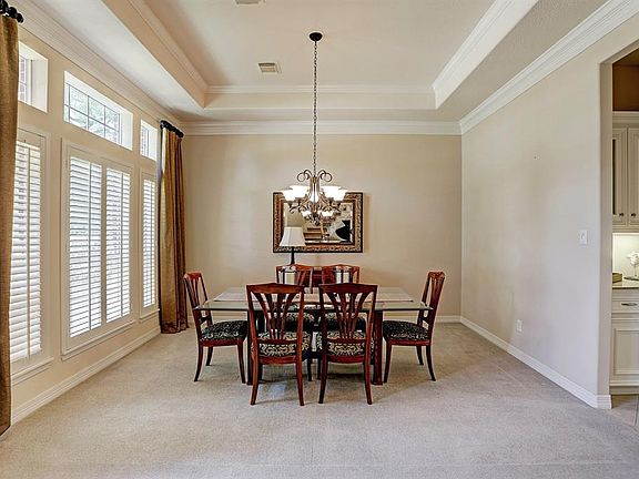 Another view of the formal dining room, just left of the front door. Notice the dry bar on the right.