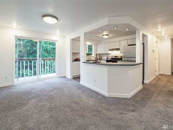 Dining room opens to balcony overlooking back yard