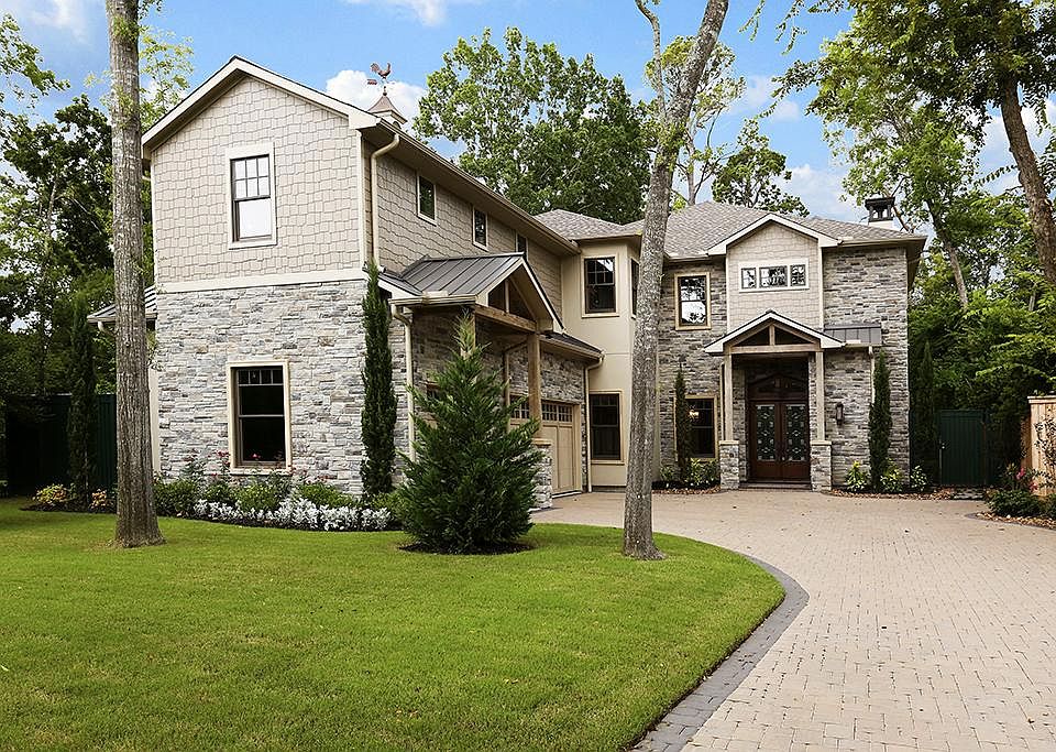 Unique Craftsman influences set this home apart and blends well with the ravine setting. Zoned 18 SE