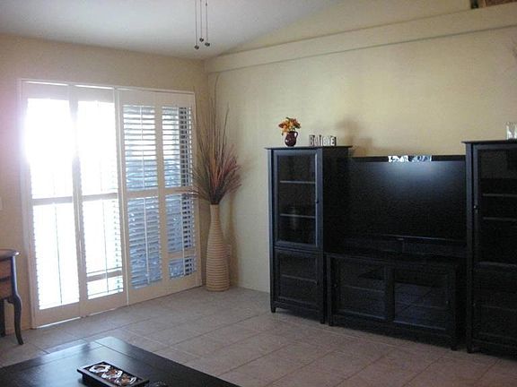 Living room-plantation shutters & flat screen tv