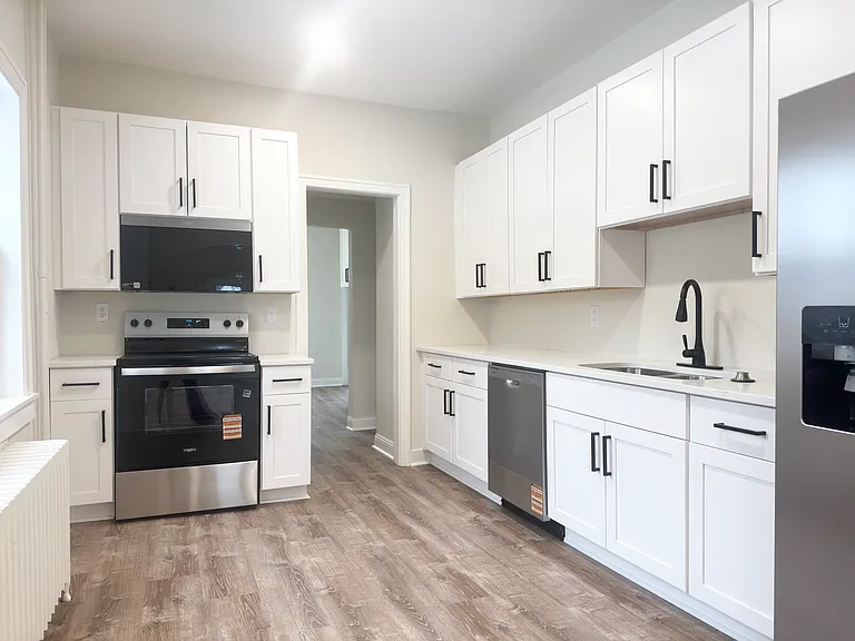 Updated kitchen with brand new cabinets, appliances, and quartz countertops