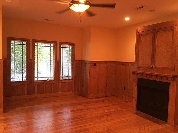 Living area with gas fireplace and TV cabinet