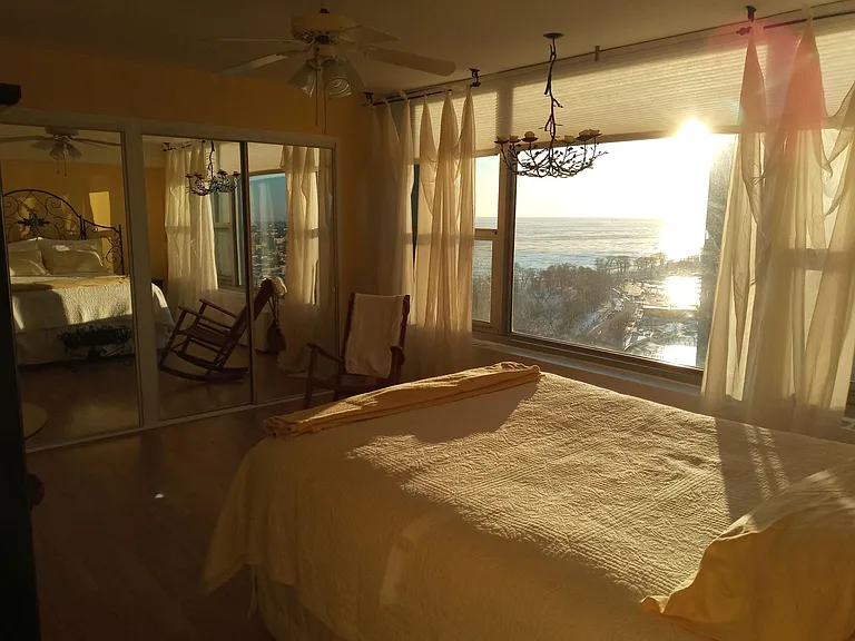 Bedroom at sunrise facing the lake and Belmont Harbor.