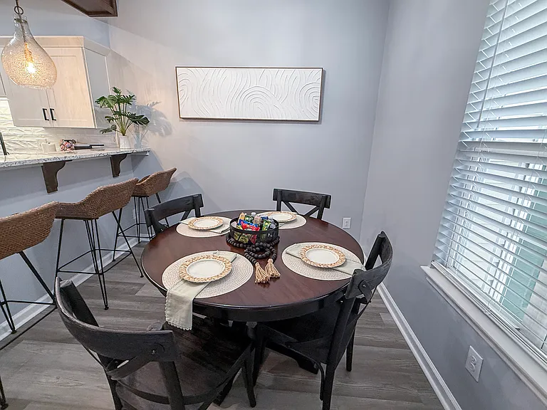 Dining area and table/chairs for 4. Additional breakfast bar seating for 4.