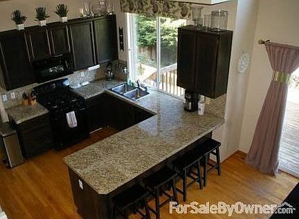Open Concept Kitchen
						:
						This kitchen with high ceilings is open to the stairs, nook, and family room.