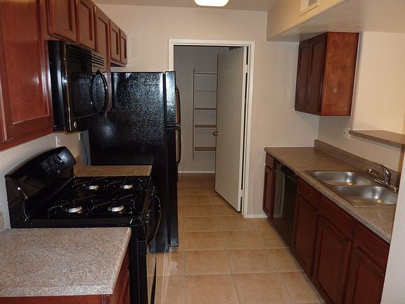 Tile kitchen and view to Laundry/Pantry. All appliances included.
