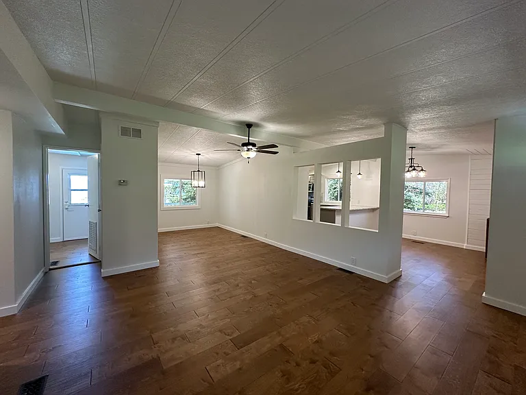 LOOKING FROM LIVING ROOM TO KITCHEN