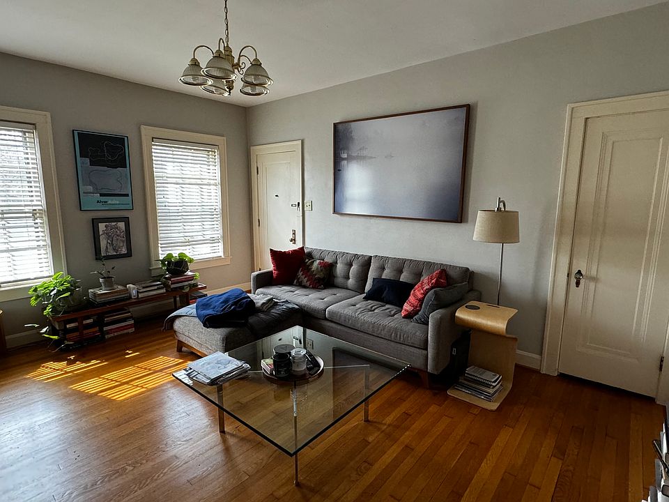 I apologize for the lighting in this picture. The space that''s available is on the right side of the building. This is the living room It contains two large closets. The door on the left is the interior front door The door on the right is a closet.