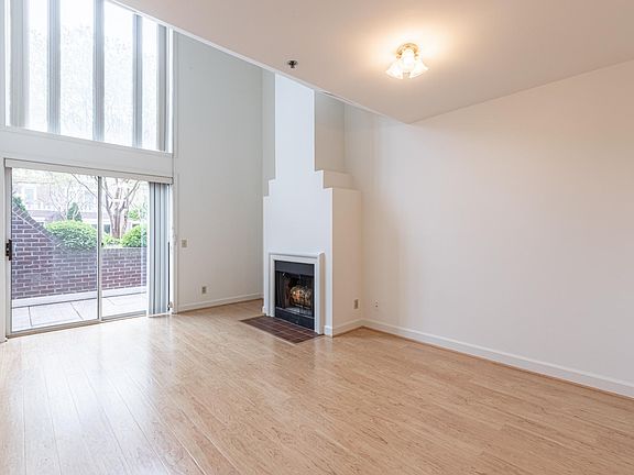 Two story windows and wood burning fireplace