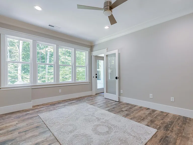 Large master bedroom with walk-in-closet. Plenty of recessed ceiling lighting with fan/light overhead