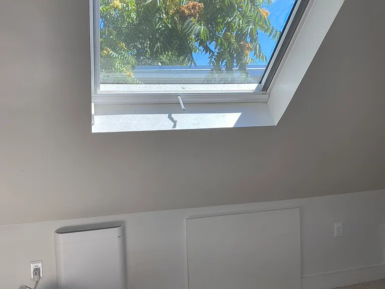 3rd floor with built-in cabinets and large skylights