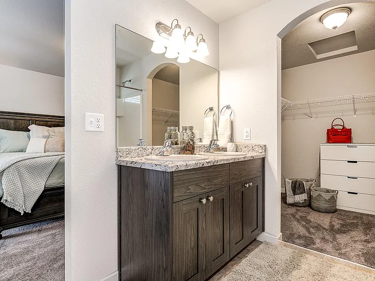 Master bath with dual vanities and walk in closet