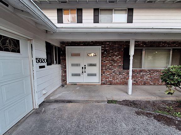 Front covered entryway with new fiberglass front door.