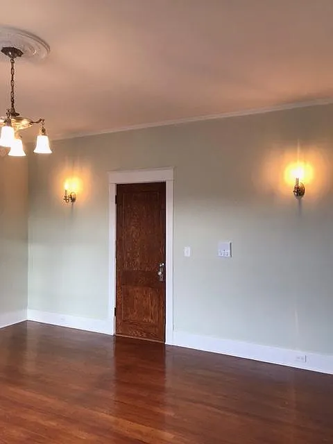 Living room view of apartment front door - 241 W 9th St #1