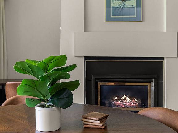 Dining room table with gas fireplace.