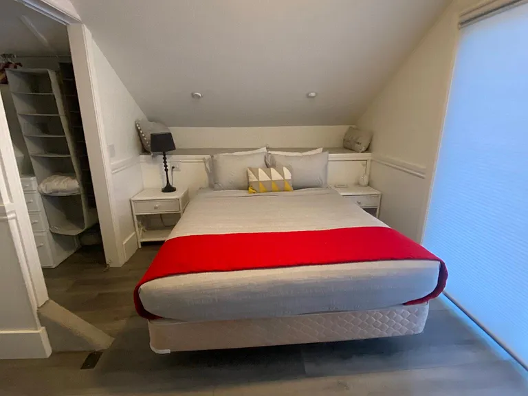 Upstairs bedroom #3 with queen bed, walk-in closet and sliding door