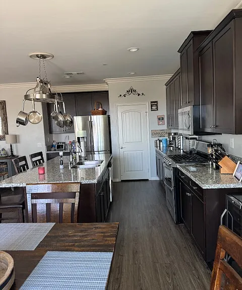View of kitchen , island, and pantry.