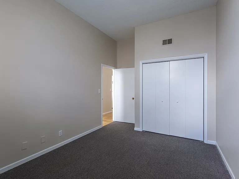 Grey carpet in a bedroom at Rosewater.