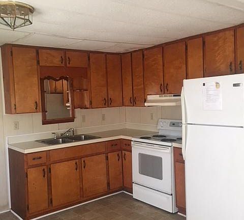 Kitchen with stove and fridge