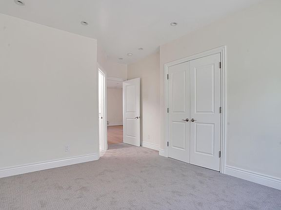 Bedroom 1 with ensuite bathroom. New carpets, large windows & closet.