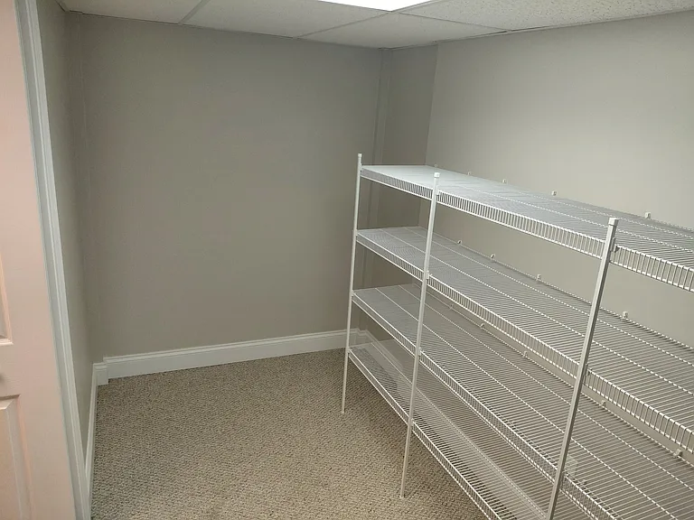 Oversized walk-in closet with extensive built-in shelving and organization space