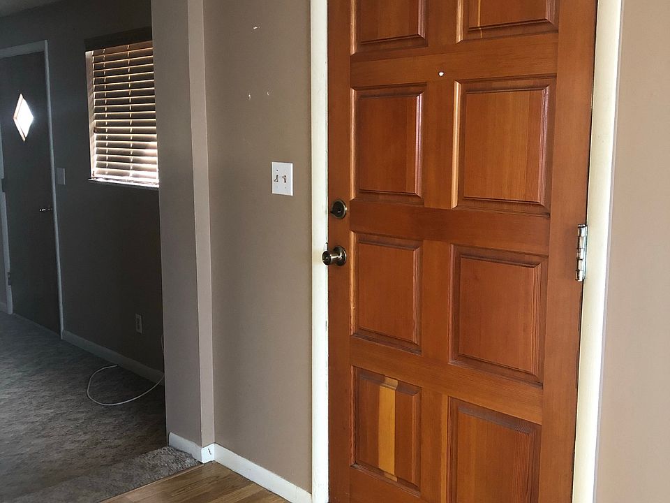 Door leading into kitchen and dining area. To the left is a separate living room.