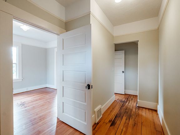 This is the foyer. The first door to the left takes you to the first bedroom. The second door on the left takes you to the living room.