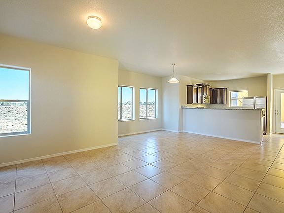 Open concept plan connects living, dining and kitchen areas. It allows for lots of natural light