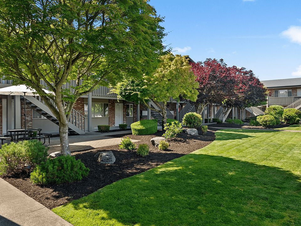 Peaceful courtyard with shaded seating areas.