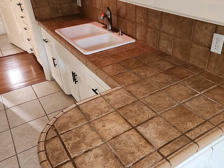 Italian Ceramic Tile, Lots of cabinet space, Kohler Porcelain sink, Moen pull out Faucet