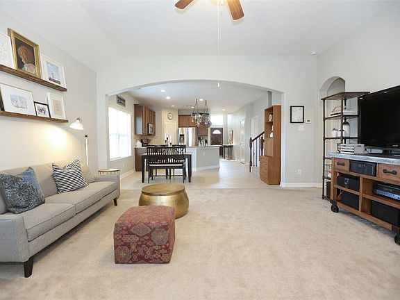 This lovely, open first floor is so welcoming! Vaulted ceilings and so much light make a cheery home.