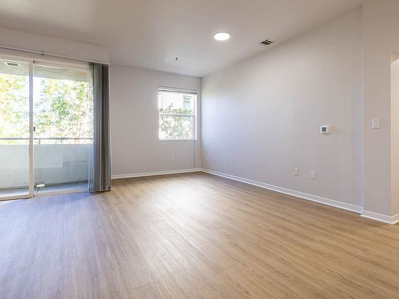 Living Room with Balcony and Har