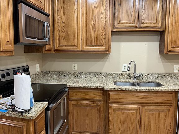 Granite countertops and built in microwave.