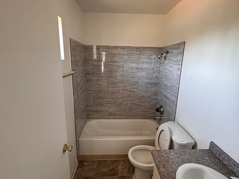 Full bathroom with vanity and tile flooring