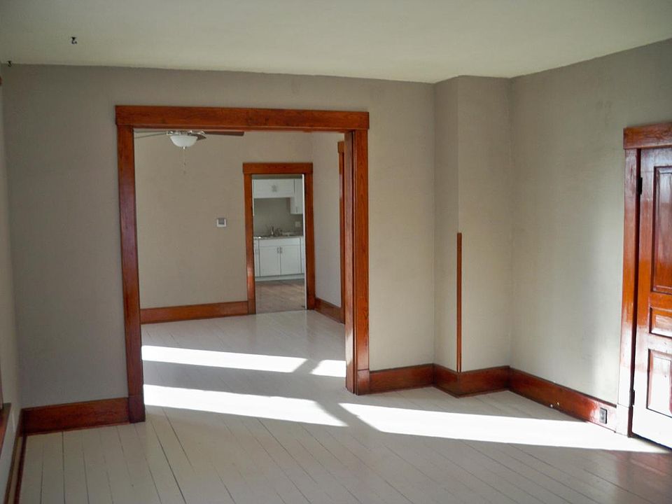 view of living room looking through to dining room/ kitchen.