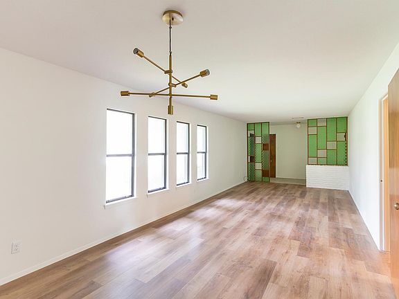 Huge formal living/flex space upon entry. New light fixtures