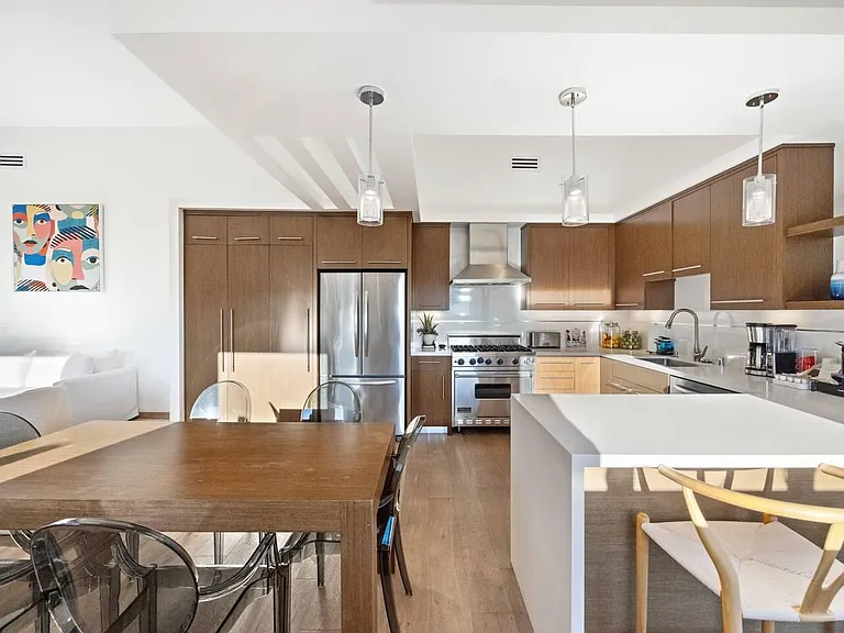 Prepare gourmet meals in style in our modern kitchen, featuring top-of-the-line appliances and ample counter space.