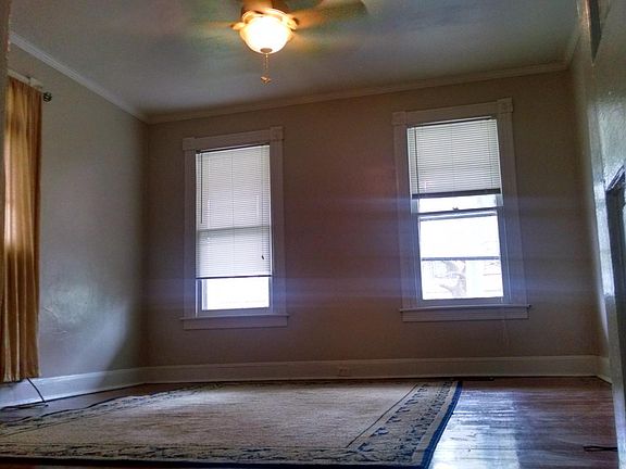 Living room windows and ceiling fan
