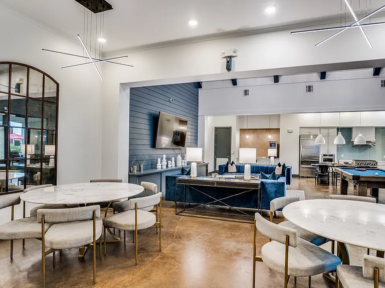 gorgeous renovated clubhouse with pool table and lounge seating