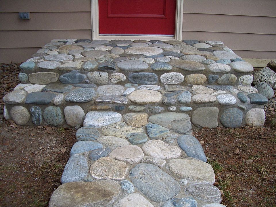 New rock walkway in front of house