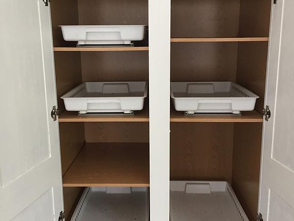 Pull out trays in kitchen cabinets